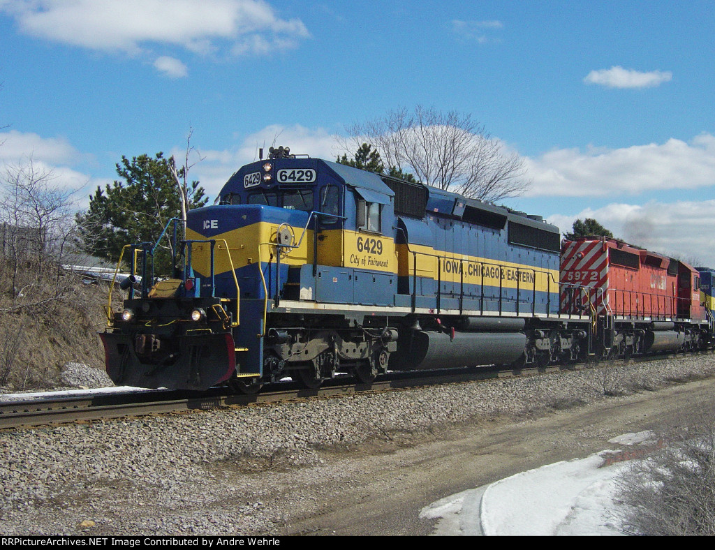 ICE 6429 "City of Fairmont" highballs Forest Grove Dr. with CP 633 WB